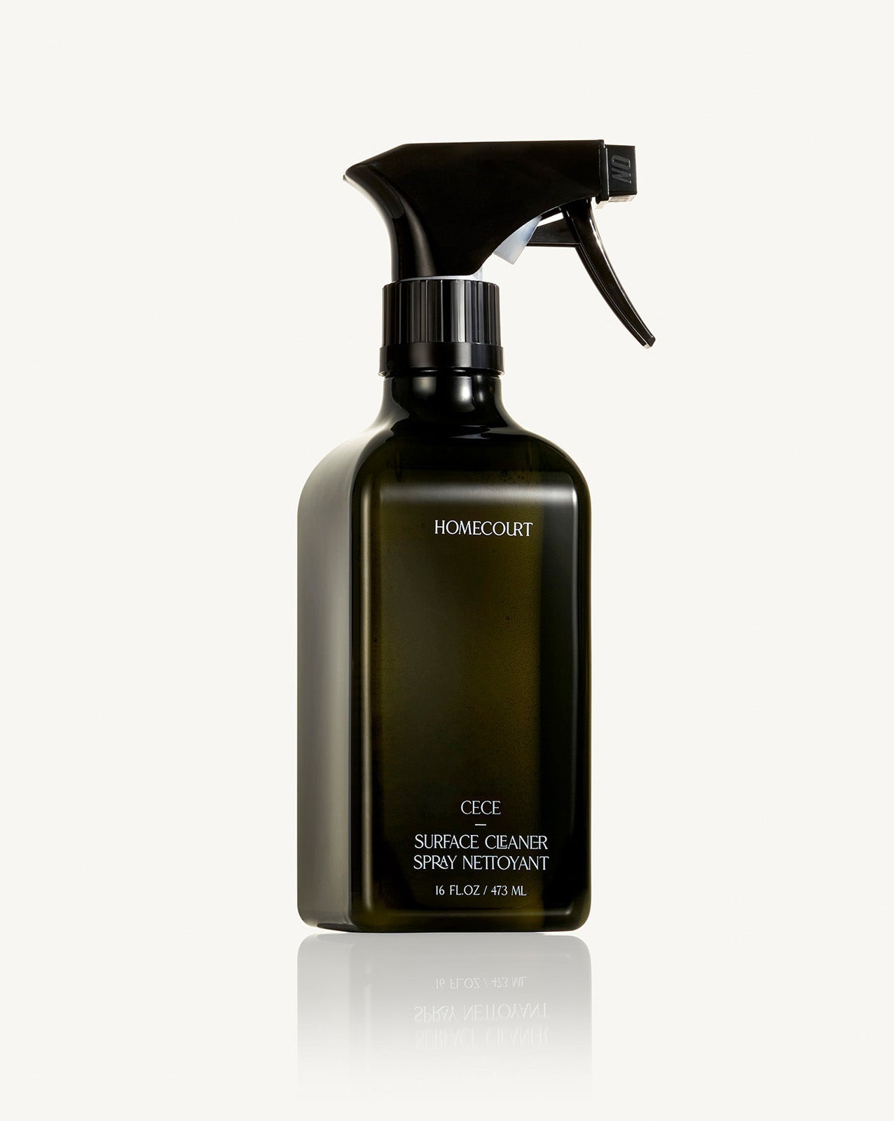 Black spray bottle labeled 'Homecourt' on a white background