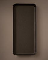Rectangular dark brown tray on a matching brown background