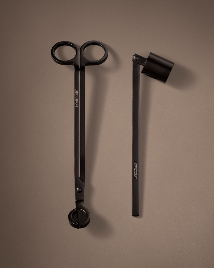 Black scissors and black pen on a brown background