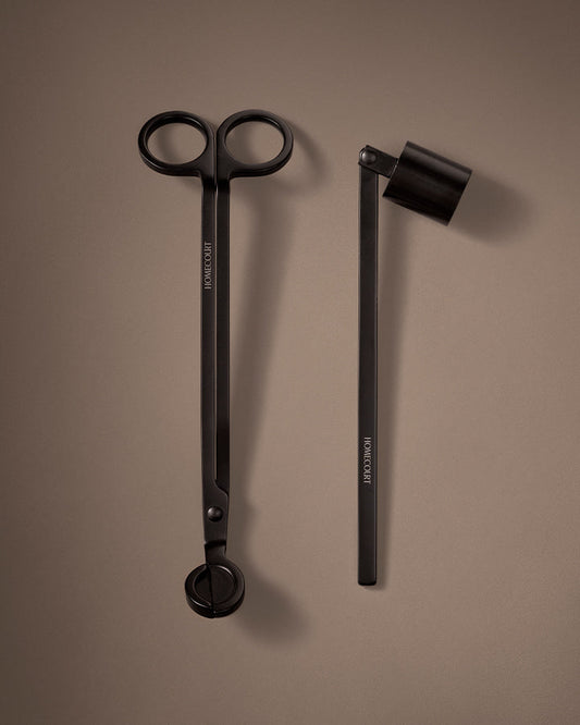 Black scissors and black pen on a brown background