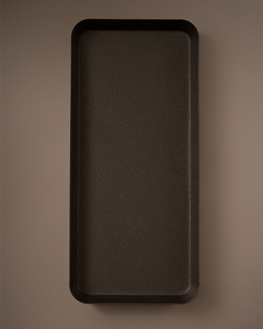 Rectangular dark brown tray on a matching brown background