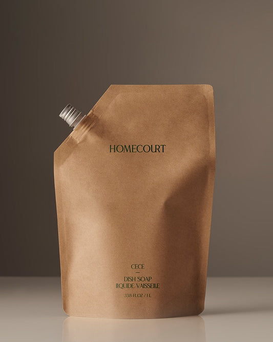 Brown Homecourt dish soap packaging on a gray background